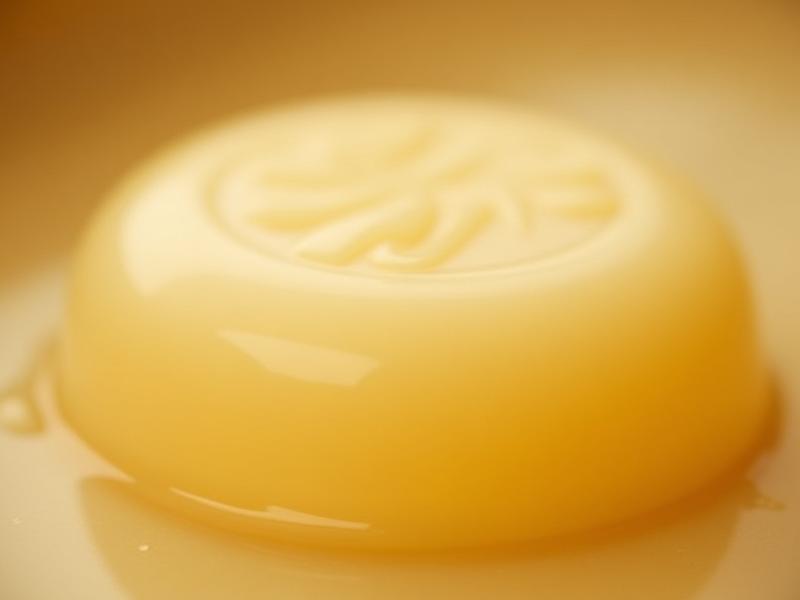 Close-up of a handcrafted Bastille olive oil soap bar with a smooth, creamy texture